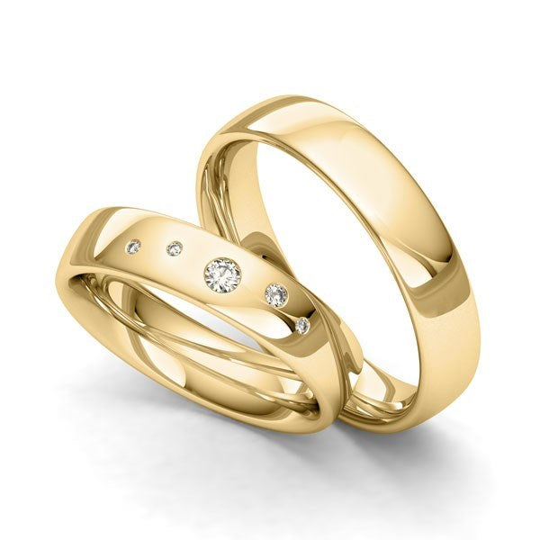 Siersbøl vielsesringe i guld med stjernedrys og 0,08 ct brillanter i elegant design