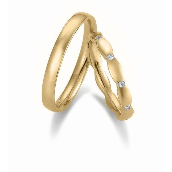 Gerstner vielsesringe i guld med buet design og 10 brillanter