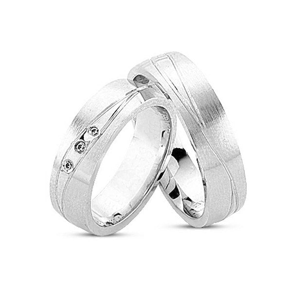 Vielsesringe i 14 kt hvidguld fra Nuran med 3 diamanter og graveret rille
