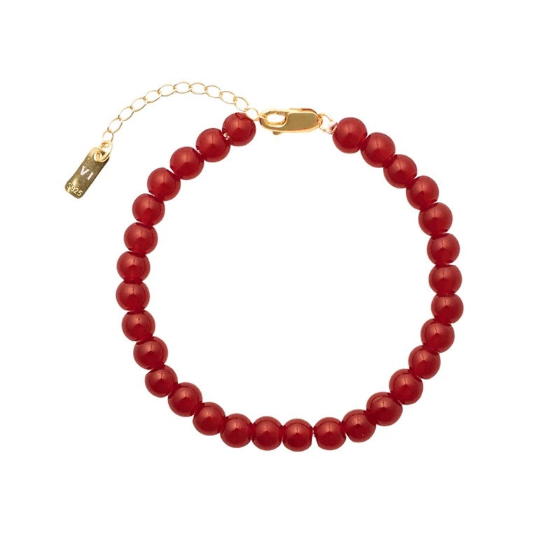Det røde Candy Coral Berry armbåndet fra House of Vincent