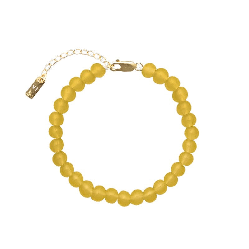Det smukke Candy Coral Honey armbånd fra House of Vincent