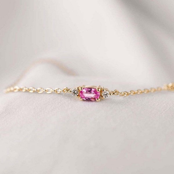 Petit oval - Pink safir armbånd i 14 kt. guld med i alt 0,05ct.