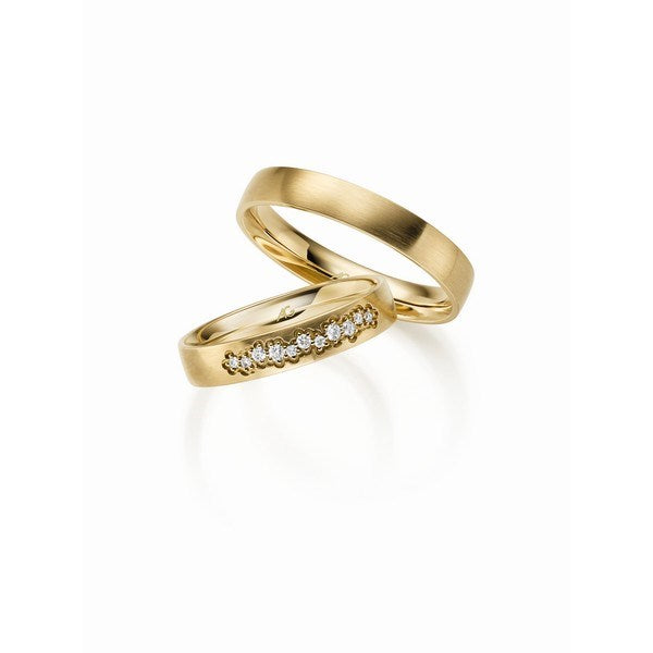 Gerstner vielsesringe i guld med blomsterformede brillanter i dameringen